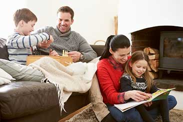 Parents and daughter drawing together.