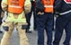 A group of emergency responders meeting in a huddle.