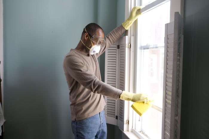 Man securing window