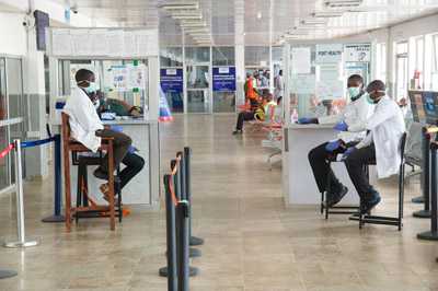 Health officials at the airport in Lungi, Sierra Leone.