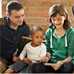 family sitting with infant