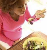 	Woman eating a salad