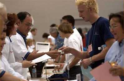 People handing out medicine in a POD (Point of Dispensing)