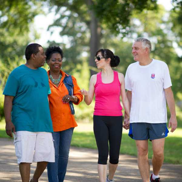 2 couples walking in the park