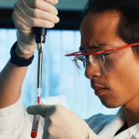 lab worker holding a test tube