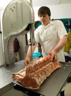 butcher cutting meat