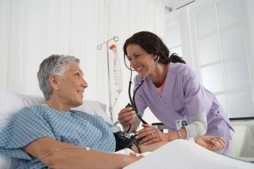 A nurse treating her patient