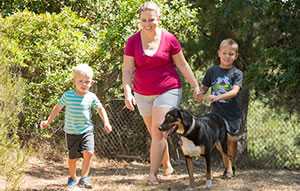 Amy with her children and her dog