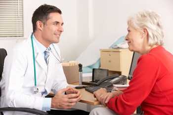 Photo of a woman talking to her doctor