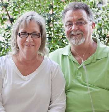 Photo of a woman and a man receiving oxygen therapy