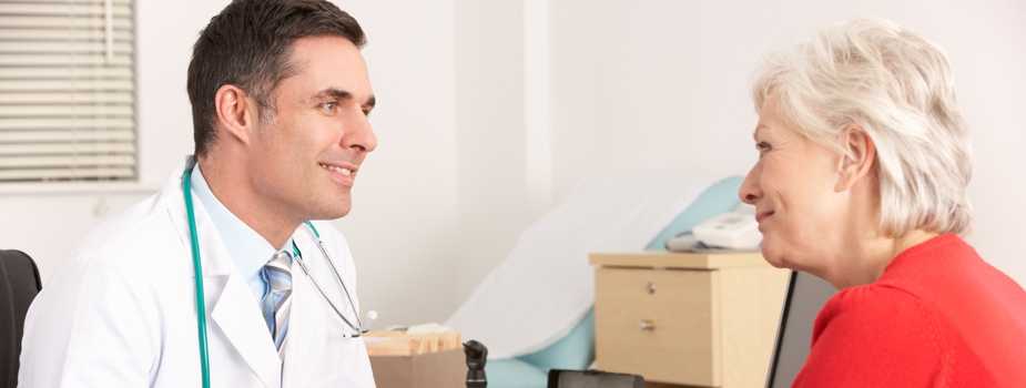 Photo of a woman talking to her doctor