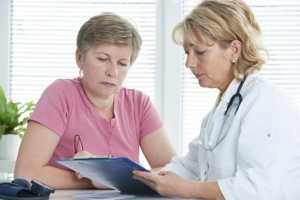 Photo of a doctor talking to a patient