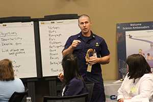 	Cdr Michael King introduces teachers attending CDC Science Ambassador Workshop to the cases method