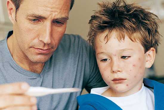 Father sitting with sick son