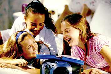 Girls laughing at a slumber party.