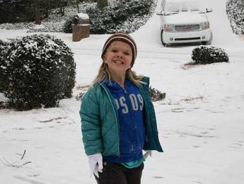 Maya in the snow smiling