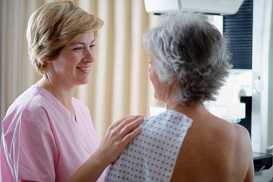 woman getting mammogram