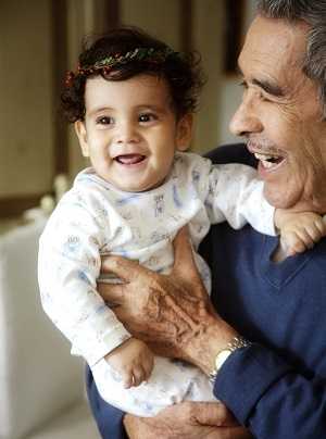 grandfather holding toddler