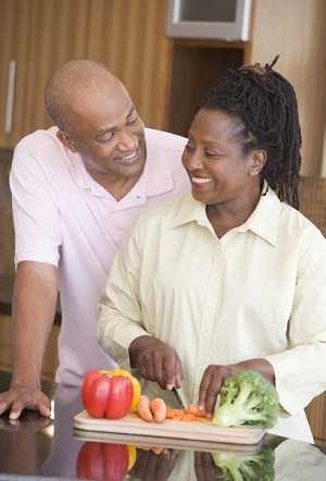 couple cutting vegetables