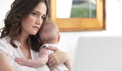 Mother holding infant.