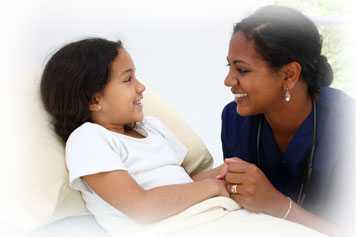 CHW holding a young girl's hand.