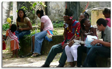 People sitting around in a park.