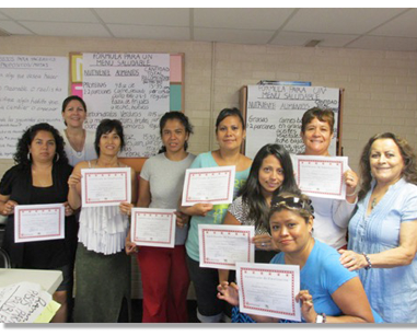 CHWs holding training certificates.