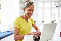 Woman working on her laptop.