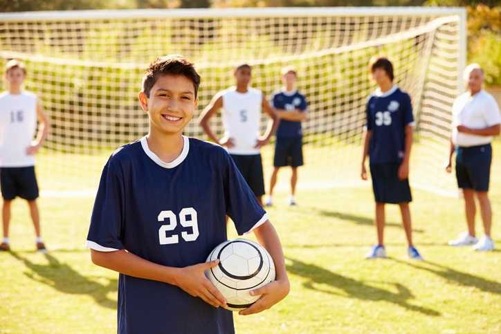 boy holding soccer ball