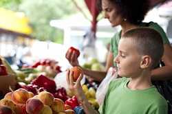 Boy and mother at farmers market