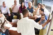 man presenting to his teammates