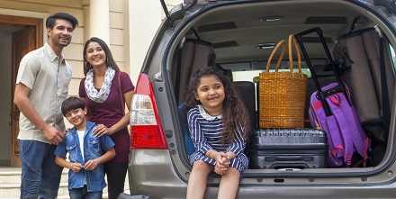 a family of four preparing for vacation