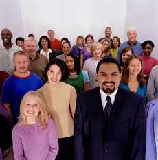 Large crowd of people posing in a studio