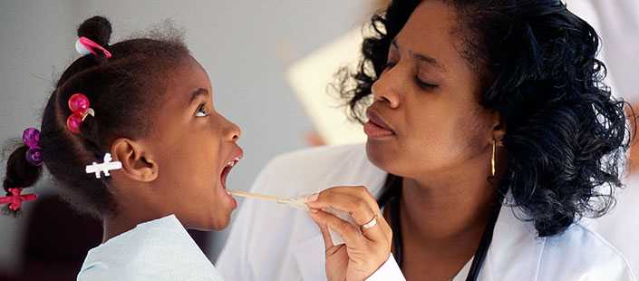 doctor examining a child