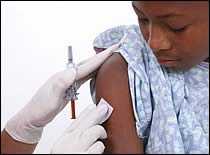 Photo of boy preparing for an immunization.