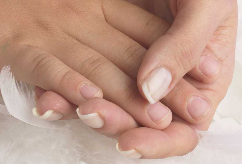 Mother's hand holding child's hand