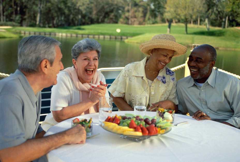 Two senior couples eating dinner