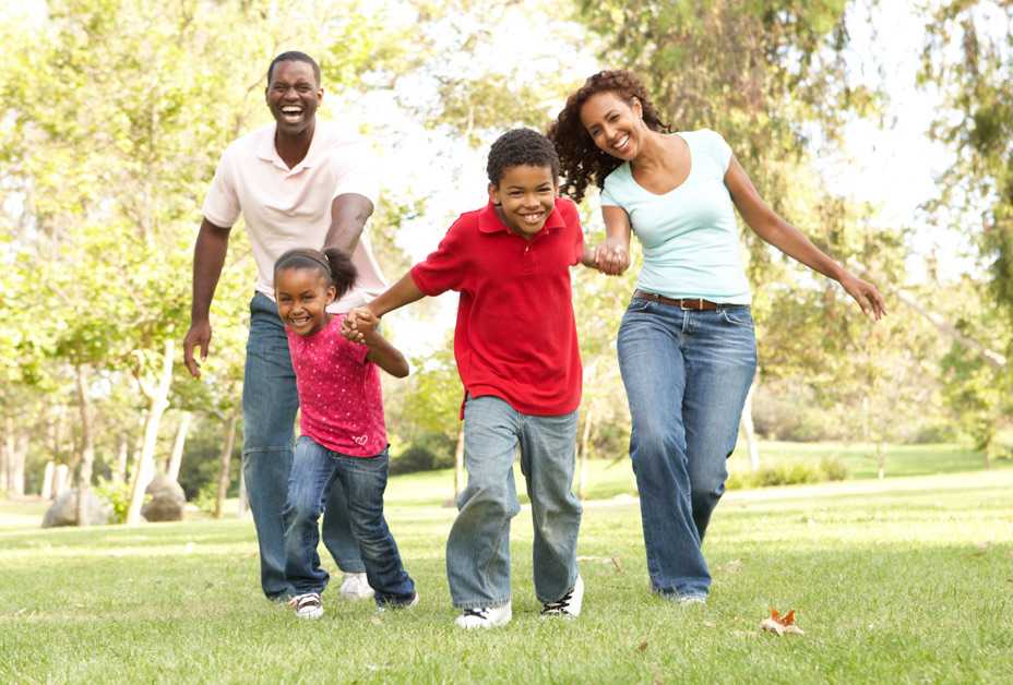 Family running through park