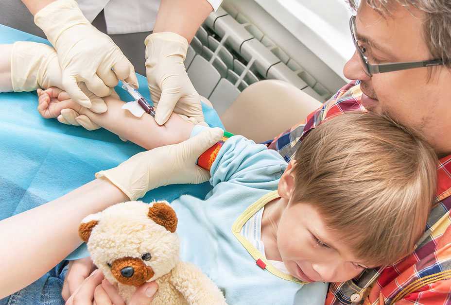 Boy getting blood test