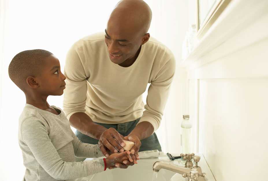 Father and son washing hands