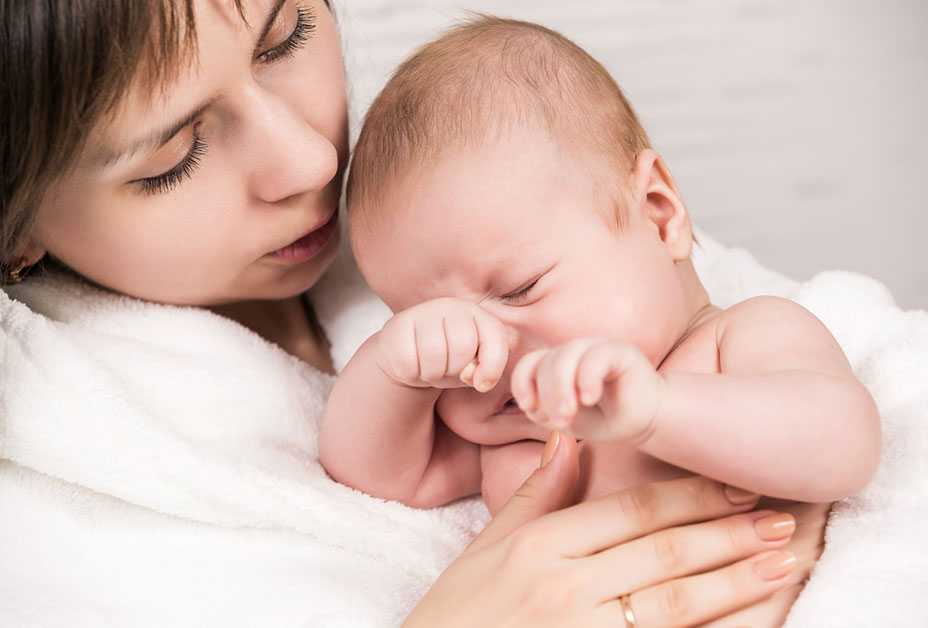 Mother holding newborn