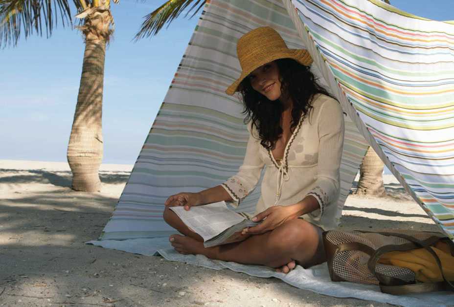 Woman reading book in the shade