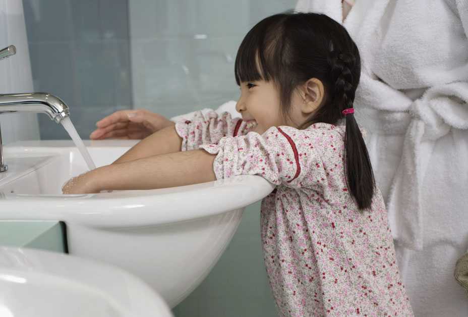 Girl washing hands