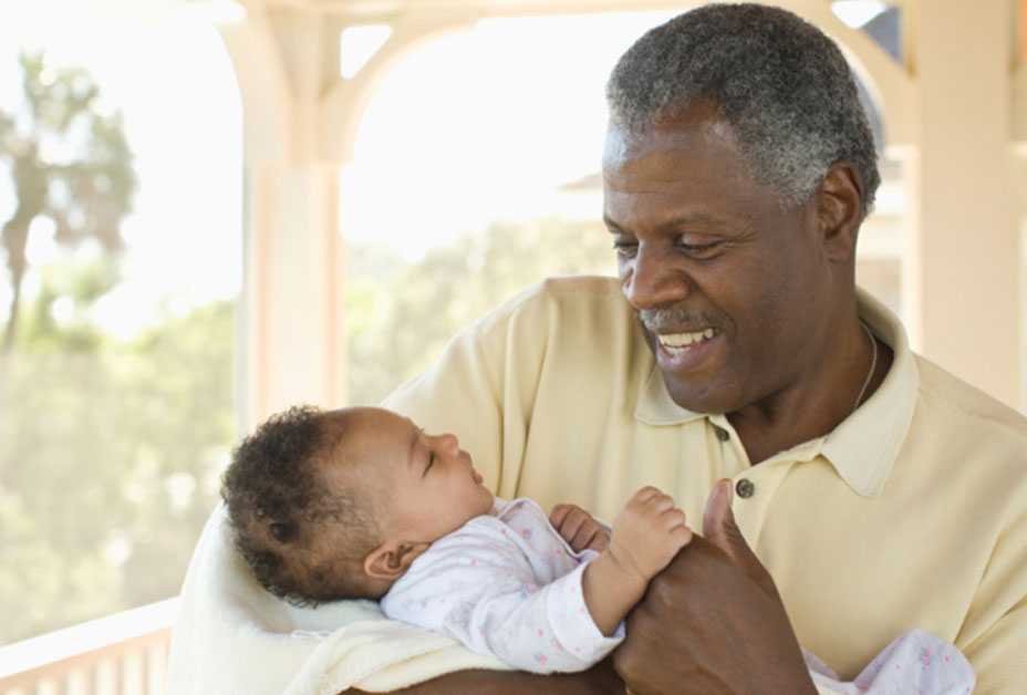 Grandfather holding baby