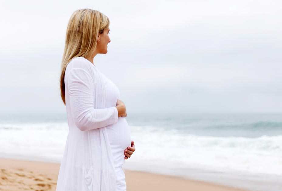 Pregnant woman at the beach