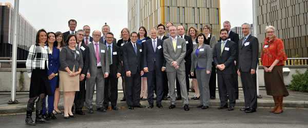 Representatives from TATFAR member institutions with (at center, L-R) co-chair Jimmy Kolker, EU Commissioner Vytenis Andriukaitis, and co-chair John Ryan