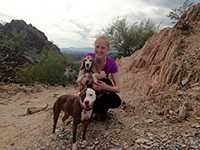 EIS officer Alison Reindel with two dogs.