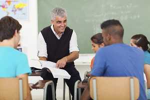 High school teacher with students