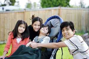 Siblings with brother in wheelchair