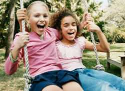 children playing on a swing